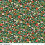 Green Christmas fabric with gifts, candy canes, stars, bells, and holly tossed pattern