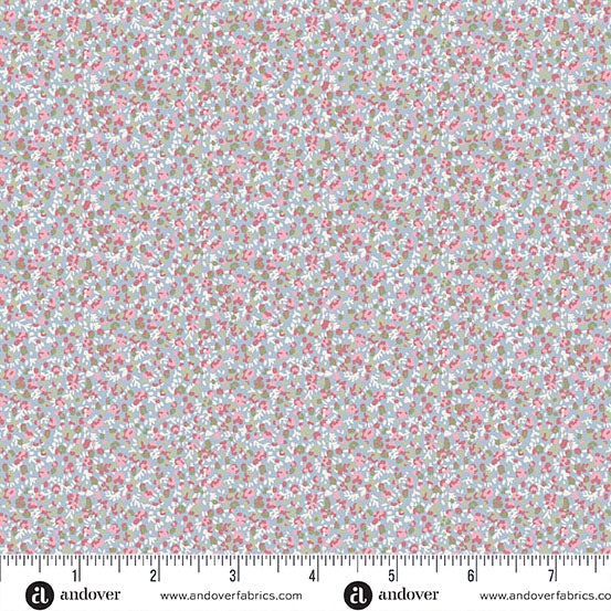 Light blue cotton fabric with tiny pink floral ditsy print, shown with ruler