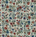 Cream corduroy fabric with red, blue, and green floral vine print pattern