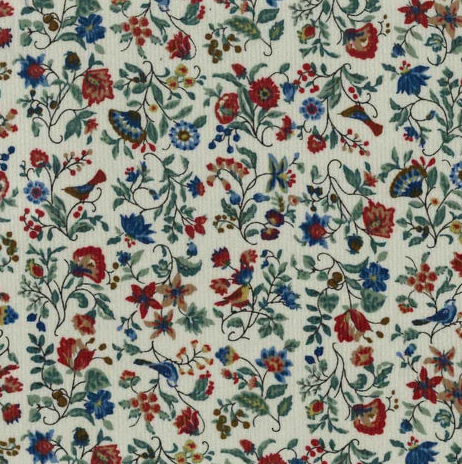 Cream corduroy fabric with red, blue, and green floral vine print pattern