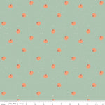 Mint green fabric with scattered small orange pumpkins and white speckles, autumn pattern