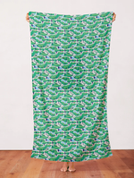 Green golf course aerial pattern fabric with fairways, water, and trees.