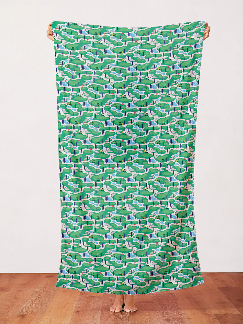 Green golf course aerial pattern fabric with fairways, water, and trees.