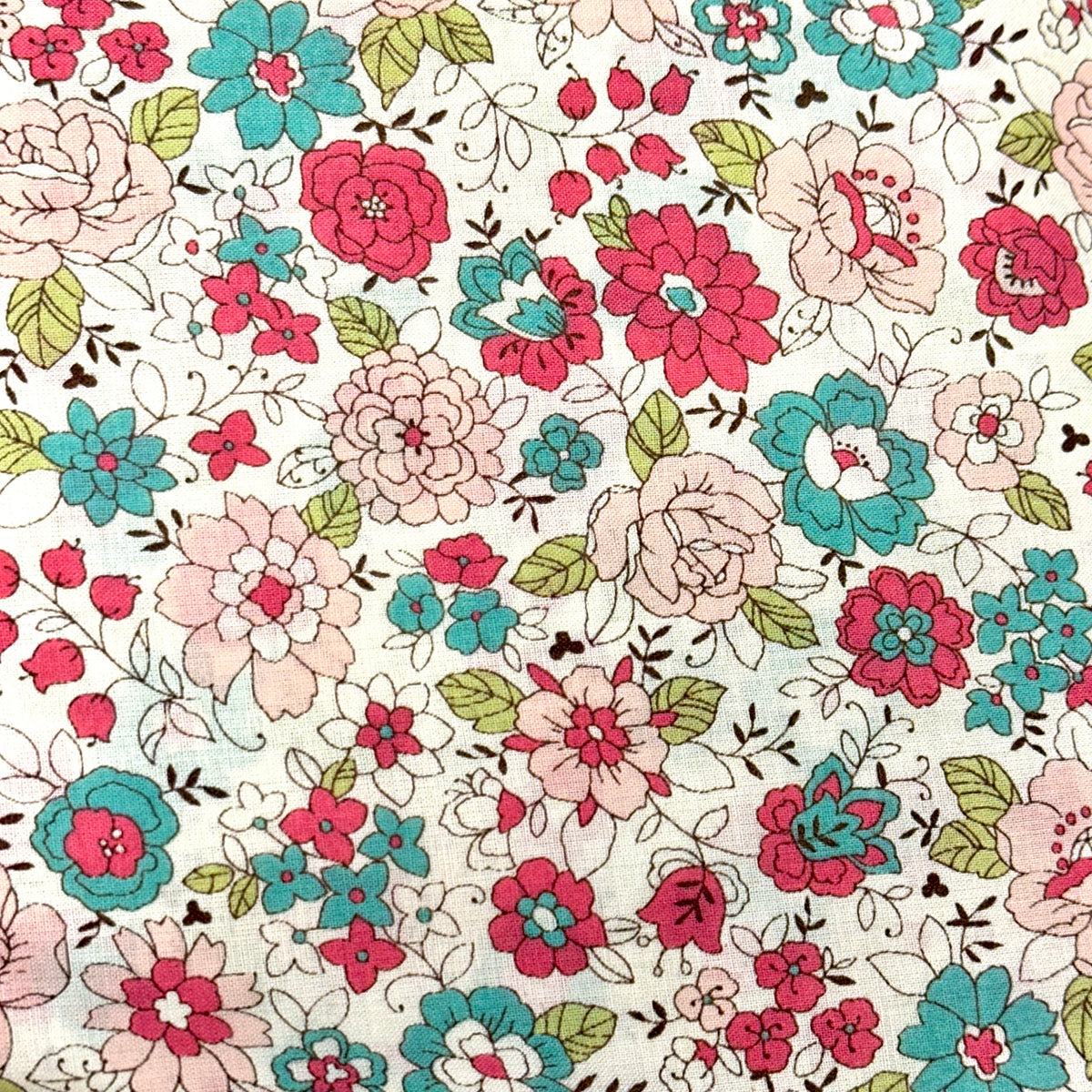 White cotton lawn fabric with pink, teal, and blush floral print pattern