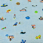 Light blue seersucker fabric with small nautical icons: boats, lighthouse, anchor, whale, sailor items.