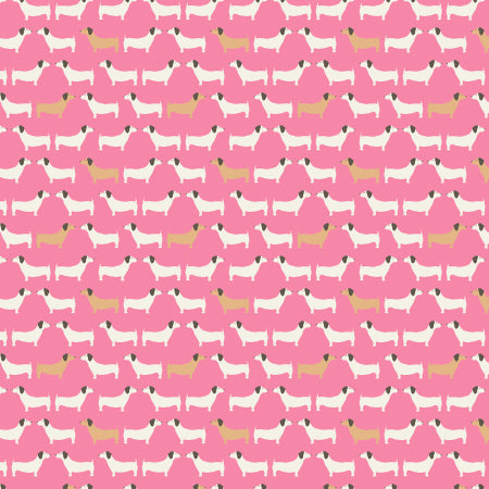 Pink cotton fabric with repeating white and tan dog silhouette pattern