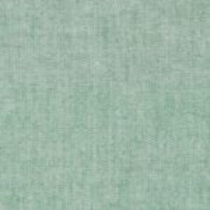 Solid spruce green chambray fabric with subtle woven texture and muted sage tone