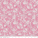 Bright pink quilting fabric with dense white floral print by Riley Blake Designs