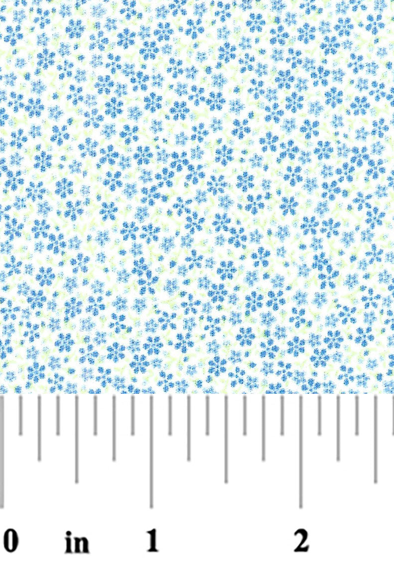 White cotton fabric with scattered small blue floral print and green accents