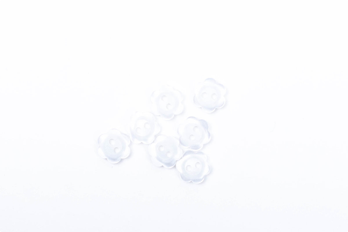 Clear translucent flower-shaped plastic buttons with two holes, set of eight
