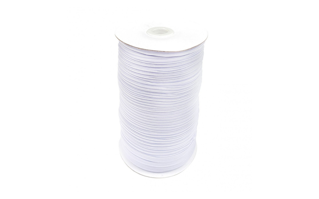 White 1/4 inch elastic cord wound on a large white plastic spool