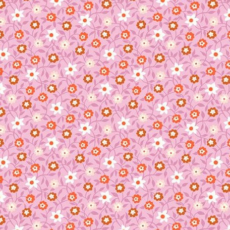 Pink quilting fabric with white and orange floral vines allover pattern