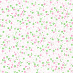 White cotton fabric with scattered small pink flowers and green leaves pattern