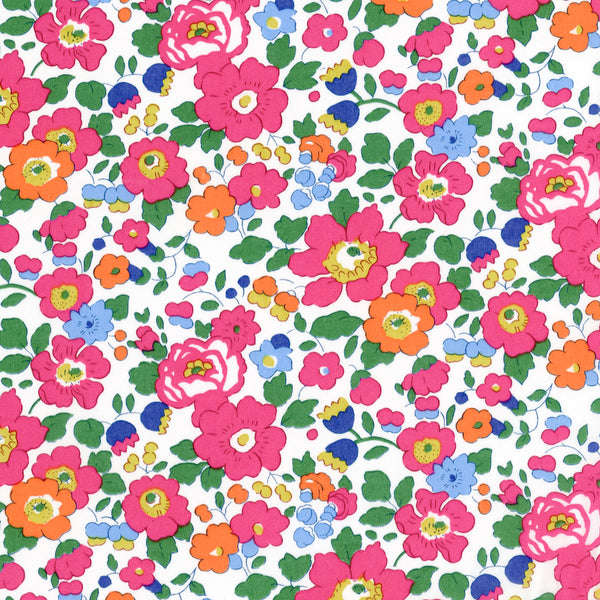Liberty Tana Lawn fabric with bright pink, orange, and blue floral pattern on white