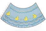 Blue smocked fabric panel with yellow duck buttons and zigzag embroidery, rows 1–8 marked