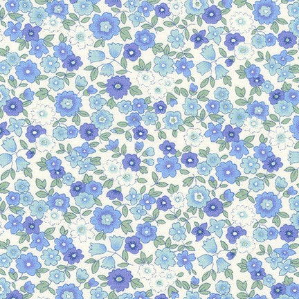 White cotton fabric with blue and periwinkle floral print and green leaves
