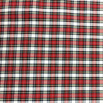 Red and white tartan plaid woven fabric with black and green accent lines