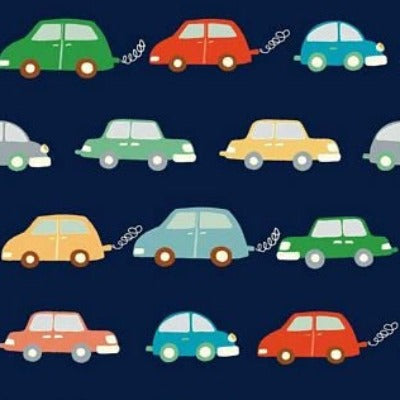 Navy blue knit fabric with colorful cartoon cars in red, green, yellow, and blue rows