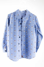 Blue micro check fabric shirt with repeating Santa Claus face pattern and dark buttons