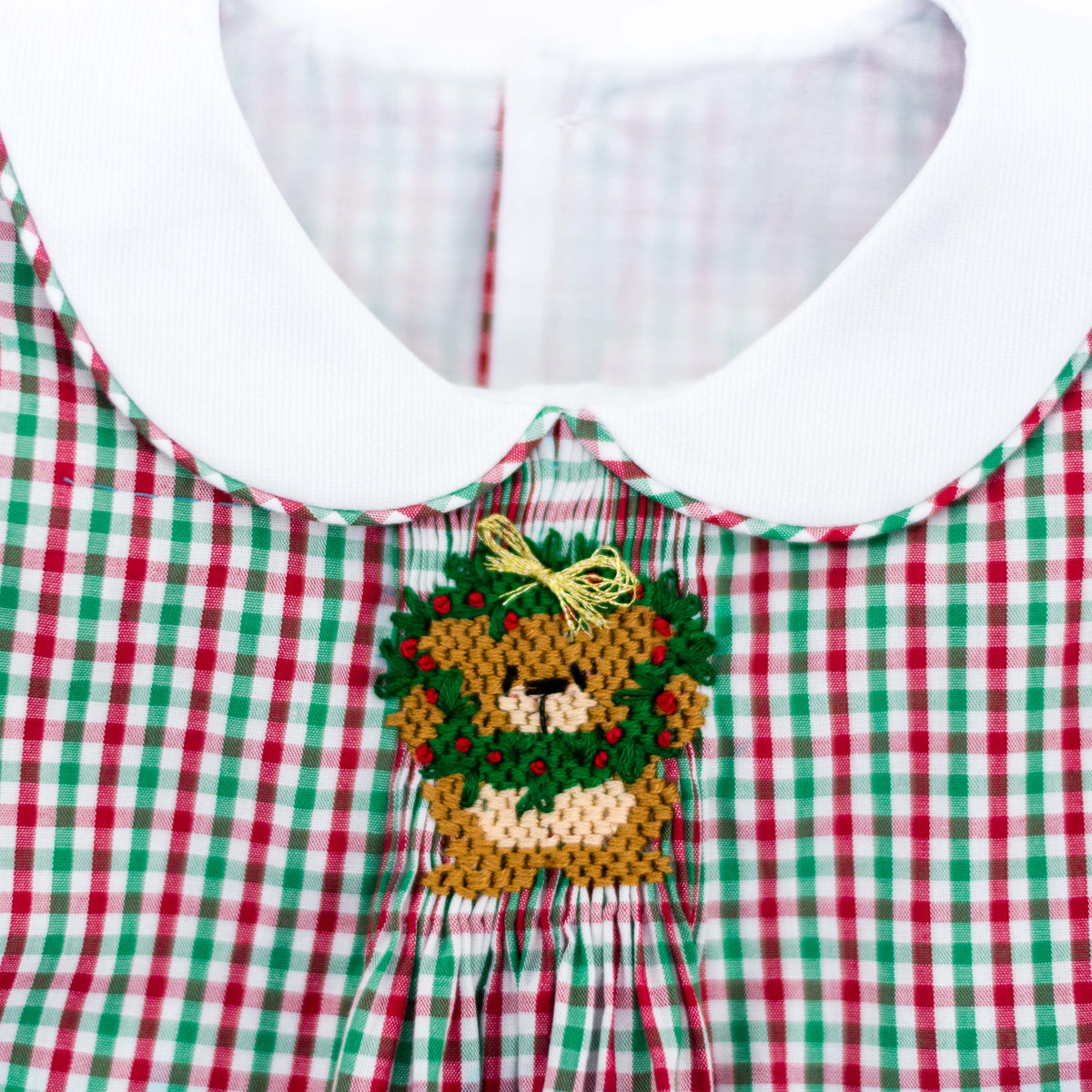 Red and green gingham check fabric with Christmas bear wreath embroidery and white collar